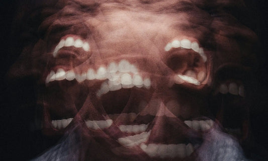 Double exposure of a distressed face with open mouth representing the emotional confusion of burnout vs depression